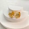 Ear cuffs roscados de diseño de moda versátil europeo y americano, pendientes de alta gama con diseño de nicho de lujo ligero, pendientes circulares nuevos