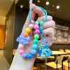 Llavero de Patita de Gato con Arena Líquida y Cuentas Colgante para Mochila de Estudiante Decoración para Llavero de Coche Muñeco Máquina Regalo Pequeño Venta al por Mayor