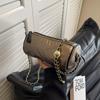 Bolso cilíndrico individual externo, popular en otoño e invierno 2024, nuevo bolso de cadena de moda para viajeros, bolso cruzado de un solo hombro de alta gama que combina con todo.