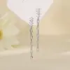 Pendientes de cadena Yixuan con cuatro circones, hilo para oreja con borla de strass súper brillante de nicho, estilo largo con un toque de alta gama