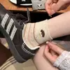 Meias Listradas de Trevo de Quatro Folhas Vazadas Estilo Coreano de Verão para Mulheres, Estilo Fino Respirável, Meias Curtas de Fio de Ponto com Filhote de Cachorro Desenho Animado Ins