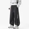 Nuevos pantalones casuales de pierna recta para trabajo de primavera y otoño para hombre, con un diseño moderno estilo americano, corte holgado, talla grande, versátil y un look sofisticado con perneras anchas.