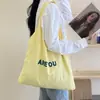 Bolsa de Doces 2024 Nova Carta Grande Capacidade Bolsa de Compras Preguiçosa Simples Casual Tecido Bolsa de Ombro Fresca