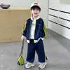 Ropa para niños, conjunto deportivo a rayas para primavera y otoño, estilo coreano, conjunto casual guapo de dos piezas para niños, ropa de bebé, comercio exterior