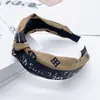 Diadema de letra de ala ancha Accesorios para el cabello retro coreano trébol de cuatro hojas Accesorios para el cabello de primavera y verano Estilo Ins Diadema anudada Accesorios pequeños y frescos para el cabello