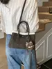 Bolsa de cubo casual de moda de primavera 2026 transfronteriza, bolso de mano con textura de nicho, bolso de hombro cruzado, bolso de mujer de moda