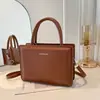 Bolso de hombro versátil para mujer estilo coreano 2026 nuevo bolso de mano de moda simple y elegante bolso cuadrado pequeño cruzado de alta gama
