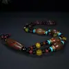 Artículos genuinos naturales Colgante de collar de ágata de Xizang de nueve ojos cenit cadena de lana estilo popular cuentas de Buda hombres y mujeres