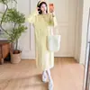 Ropa de maternidad otoño e invierno nuevo estilo vestido de punto trenzado con corbata cuello redondo manga larga suelto cubre el vientre estiliza prenda exterior falda larga