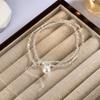 Collar de plata rota con dos perlas y diamantes individuales para mujer, sencillo, combinable con todo, ligero, de lujo, con diseño de nicho, estilo frío, cadena de clavícula con ojos de succión de verano.