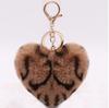 Leopardo europeo y americano amor felpa bola de pelo llavero placa bola de pelo llavero colgante para mujer Regalos Creativos Mayoreo