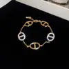 Pulsera Trenzada Hebilla de Herradura Redonda de Circonita Roja Europea y Americana Diseño de Nicho Pulsera Exquisita de Gama Alta para Mujer