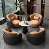 Conjunto minimalista y lujoso de sofá individual y mesa de centro, adecuado para uso casual en hoteles, salones de belleza, áreas de recepción y centros de exposiciones; también incluye un juego de mesas y sillas para reuniones y discusiones
