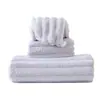 Al por mayor forro polar color liso franja ancha 3cm toalla corrugada engrosada suave toalla facial absorbente toalla de baño para el hogar
