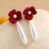 Europa y Estados Unidos tendencia caliente moda nicho diseño temperamento elegante dulce flor aretes colgantes largos de perlas