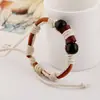 Comercio exterior exportación joyería joyería pequeña al por mayor pulsera tejida de piel de vaca pulsera de cuero vintage joyería de tienda de 2 yuanes