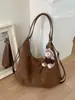 Bolso tote retro popular de temporada cruzada bolso de axila nuevo estilo moda Otoño 2026 bolso de hombro sensación de alta gama mochila