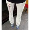 Jeans con vibra de calle americana, estampado de rayos de moda, pantalones acampanados de corte recto slim-fit para hombre, pantalones de corte curvo adelgazantes