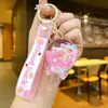 Chaveiro Pirulito Areia Movediça Luminoso Infundido com Óleo Pingente Fofo para Mochila Chaveiro Presente de Parque de Diversões Brinquedo Infantil