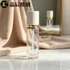 Em estoque Frasco de vidro redondo reto 30ml para base com tampa branca borda dourada frasco com bomba de pressão para loção frasco para decantar base
