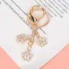 Novo Pingente Chaveiro de Metal Sakura Menina Simples Coração Flor Decoração de Celular Acessórios Pingente de Bolsa Venda por Atacado