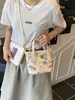 Bolsa feminina de nicho de alta qualidade transfronteiriça 2026 nova moda bolsa tiracolo estampada, bolsa de balde de mão super popular