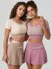 Traje Esportivo de Corrida Juyitang Alta Elasticidade Cor da Pele Color Block Falso Duas Peças Traje Anti-Exposição para Mulheres
