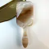 Europa y Estados Unidos transfronterizos patrón de agua color bolsa de aire peine onda de agua lámina acrílica peine de cojín de aire peine de peinado para mujer peine de peinado masajeador para rizar el cabello