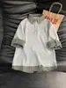 Camisa Polo Patchwork Xadrez Falsa de Duas Peças para Homem, Verão 2026, Camiseta Casual Solta de Manga Curta com Gola Reversível