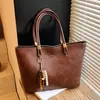 Bolsa feminina vintage estilo coreano transfronteiriça, grande capacidade, novo modelo verão 2026, bolsa de ombro simples versátil, bolsa tote para o trabalho