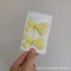 Pin para el pelo de niña estudiante con temperamento dulce, borde de oreja de madera amarillo claro, pinza de par de lazo pequeño, pinza de borde, pinza para flequillo