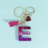 Fornecedor e Vendedor de Chaveiros com Alfabeto de Lantejoulas Três Cores, Chaveiros com Franja em Formato de Coração, Pingentes para Bolsas Femininas