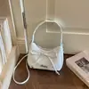 Bolso de hombro/bandolera de diseño de nicho versátil y elegante con lazo texturizado y lentejuelas de estrella estilo coreano 2026