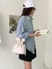 Bolso tipo cubo ligero con cordón de nailon estilo coreano Ins Modelo Nuevo 2026 Moda Transfronteriza Versátil Bolso de Hombro Moderno