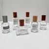 Botella dispensadora de perfume de lujo ligero con tapa de madera de rosca, botella de spray de vidrio, botella vacía de presión, botella de presión de repuesto de muestra de 30 ml