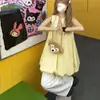 Vestido colete sem mangas com design plissado de cor sólida doce estilo francês para mulheres, verão 2025, saia tipo botão solta emagrecedora