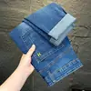 Jeans Rasgados para Hombre Marca de Moda Otoño/Invierno Nuevo Estilo Versátil Regular Lavado Pierna Recta Ajustada Pantalones Largos Venta al por Mayor