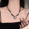 Collar de mariposa de cerámica con cuentas redondas de estilo étnico para mujer, nuevo estilo chino, estilo retro elegante, cadena de clavícula de estilo frío, a la moda.
