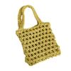 Bolsa de algodón tejida de mano linda al por mayor de fábrica, nueva bolsa versátil de color sólido tejida de paja hueca, bolsa de malla para la mano para mujer