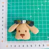 26 Estilos Nuevos de Accesorios para Pasadores de Pelo, Broches, Bolsas, Ropa, Sombreros, Zapatos, Calcetines y Accesorios de Vestimenta con Relleno de Algodón en Forma de Cachorro y Moño