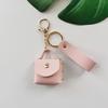 Chaveiro de bolsa em PU transfronteiriço couro cor sólida com pingente de corda acessórios acessórios para celular pingente de carro presente para live