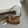 Bolso de axila de diseño de nicho transfronterizo para mujer, bolso moderno retro y de moda, bolso de hombro cruzado de gamuza elegante de alta gama para el día a día