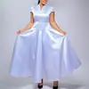 D643 Moda europea y americana para mujer, vestido largo de color liso brillante elegante con cuello en V, manga corta y bajo ancho para exportación