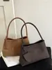 Bolsa tejida de axila de estilo francés de nicho Shuai Mi Jia para mujer, nueva bolsa elegante para el trabajo de otoño 2026, bolso de hombro vintage