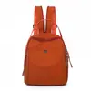 Mochila pequeña moderna y suave para mujer, mochila de doble hombro de tela de nailon ligera, nuevo modelo 2026 para viajes y desplazamientos