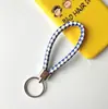 Llavero creativo llavero de cuerda de cuero cordón para llaves colgante de joyería cordón tejido fábrica de cuerda de cuero venta al por mayor