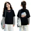 Camiseta de algodón a rayas de manga larga, estilo coreano y moderna, para niñas, un nuevo diseño de primavera/otoño, corte holgado, versátil y con cuello redondo, adecuada para niños de talla mediana a grande