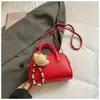Nueva Tendencia de Moda Bolso de Mano para Mujer de PU Color Sólido Versátil Viaje Lápiz Labial Maquillaje Bolso de Hombro Cruzado Transfronterizo