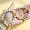 Producto genuino de zona escénica: Cuentas de porcelana color gris macarrón-rosa con diseño de corazón-sutra blanco, pulsera para mujer, cuentas de vidrio color ceniza de incienso, pulsera auspiciosa con pan de oro, cuentas de vidrio