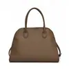 Bolso de mano portátil retro simple y generoso europeo y americano para mujer 2025 Primavera Versátil Patrón de lichi Bolso cruzado casual para el trabajo